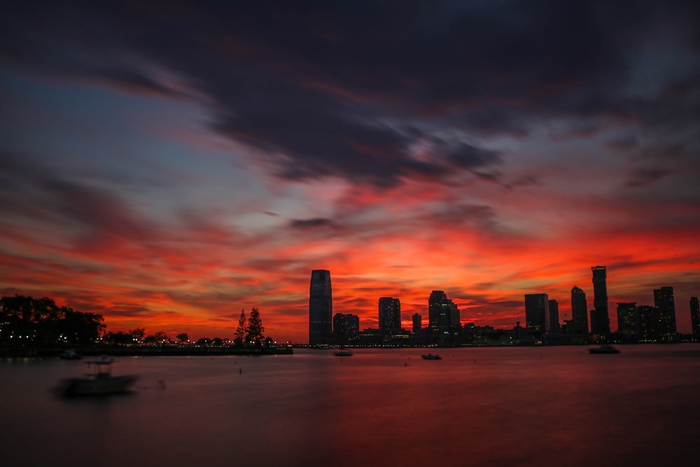 cityscape by water under golden hour