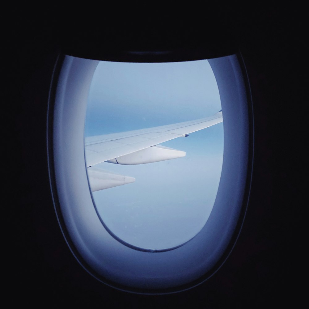 window panel overlooking airplane wings