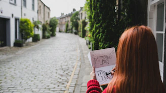 woman drawing building
