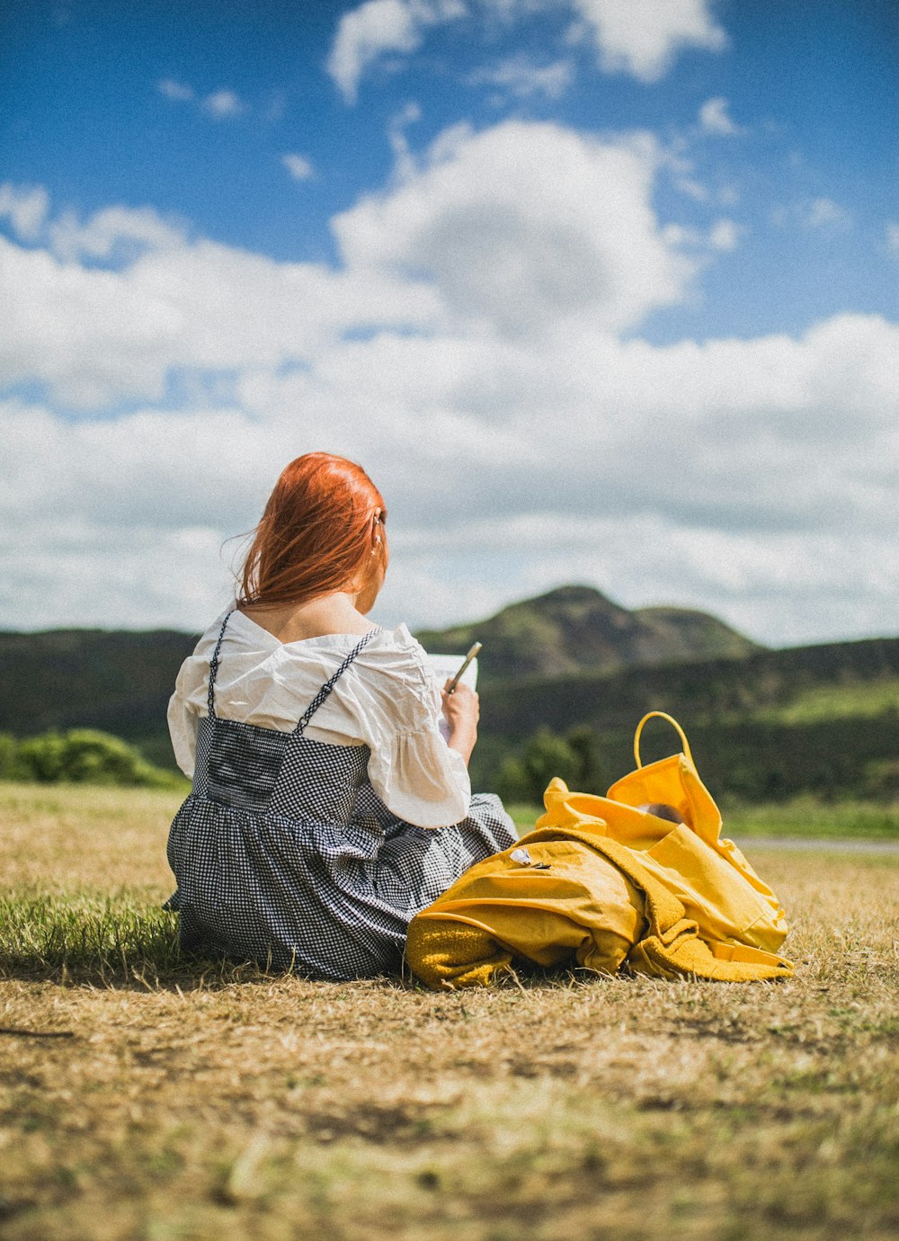 woman sitting on field