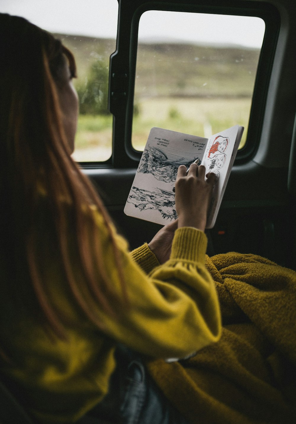 Woman Drawing Inside Vehicle Photo Free Person Image On
