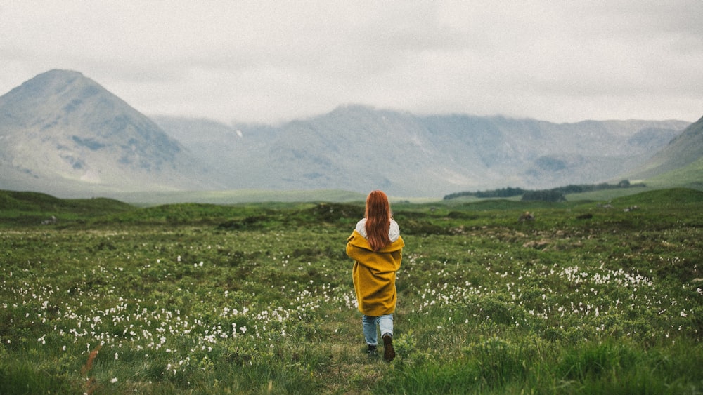 woman standing on green field