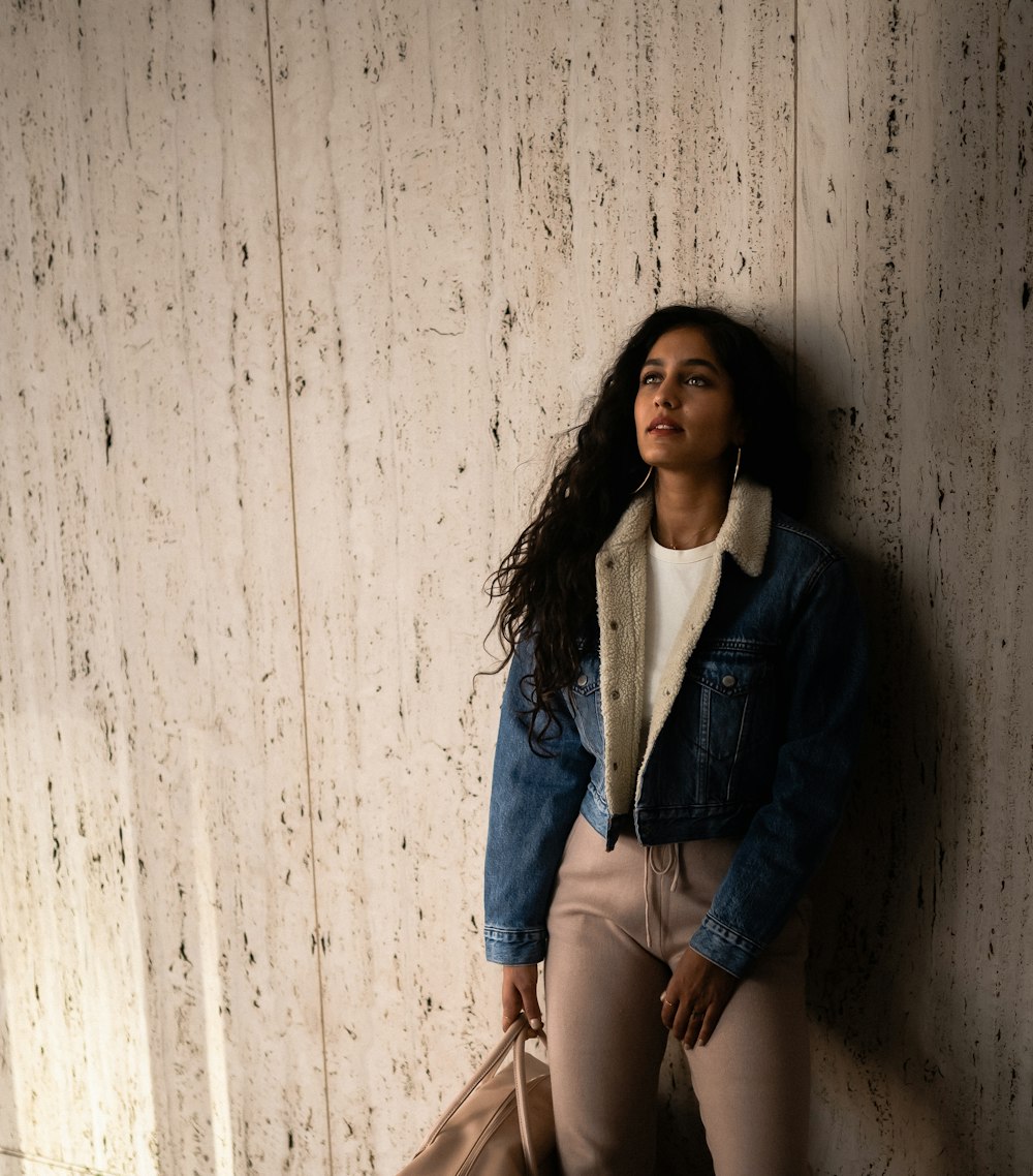 woman wearing blue denim jacket