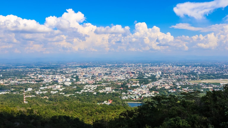 A panoramic view of a sprawling virtual city powered by sustainable gaming technology.