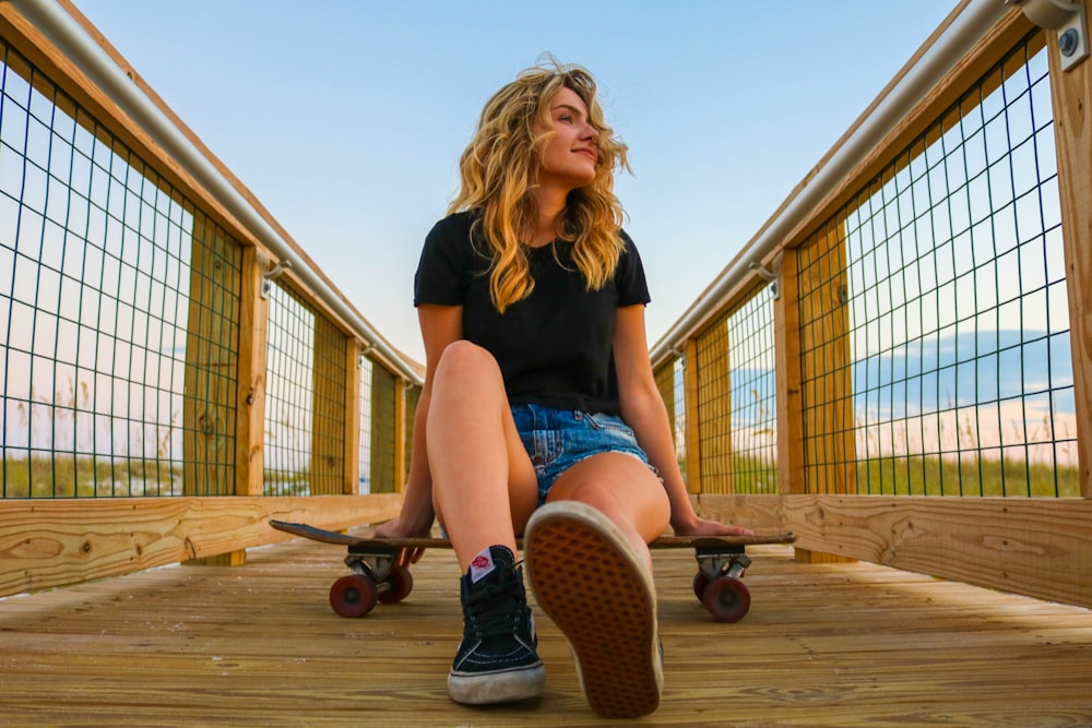 woman sitting on cruiser board