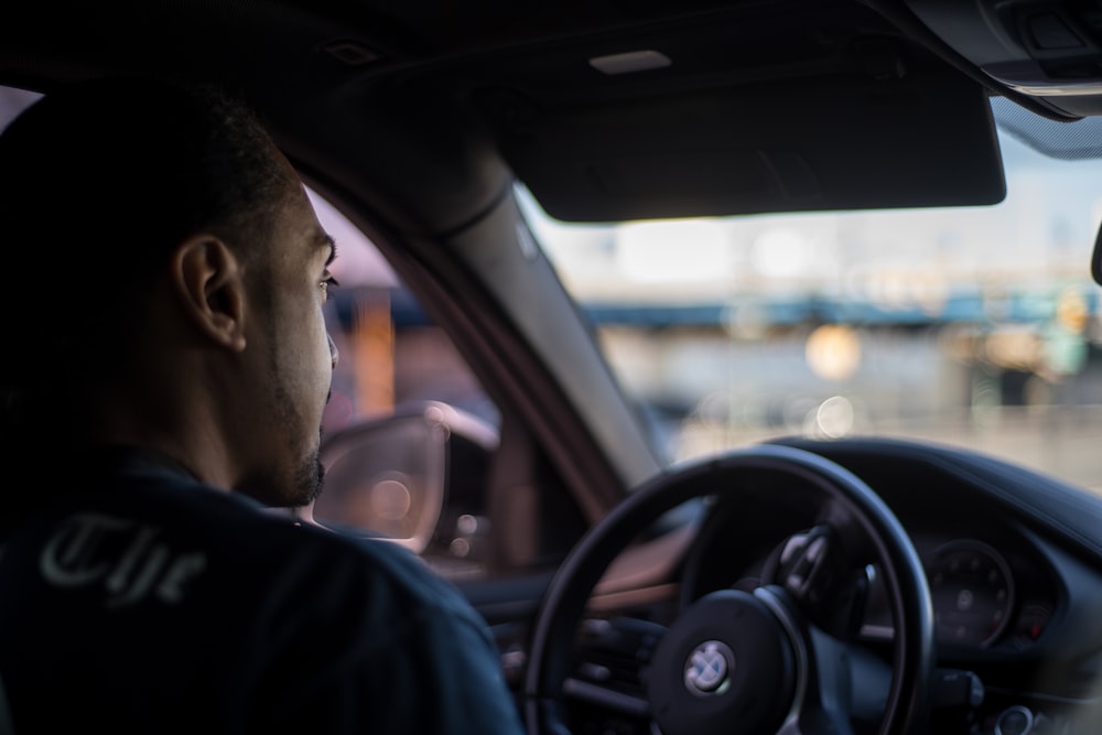 man in BMW vehicle