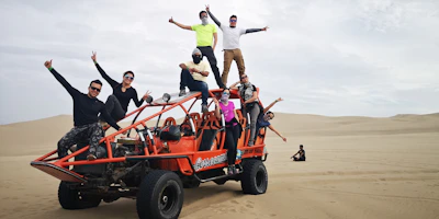 Diverse group of happy customers standing beside a Porsche Macan in the Arizona desert.