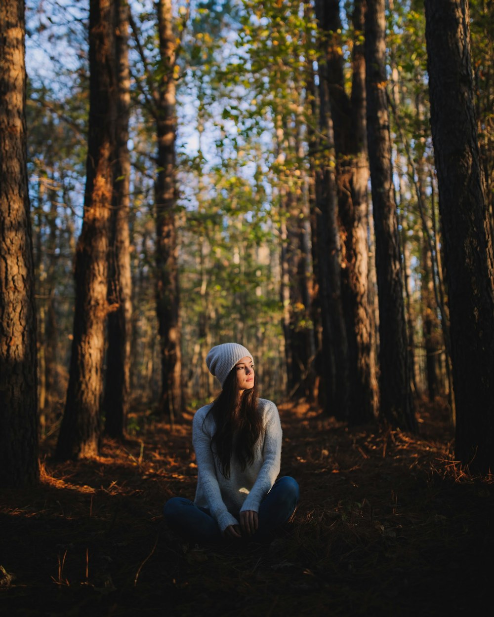 woman sitting in forest