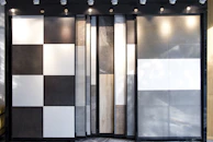 Wall cladding panels in black and white tones, adding texture and depth to a living space.