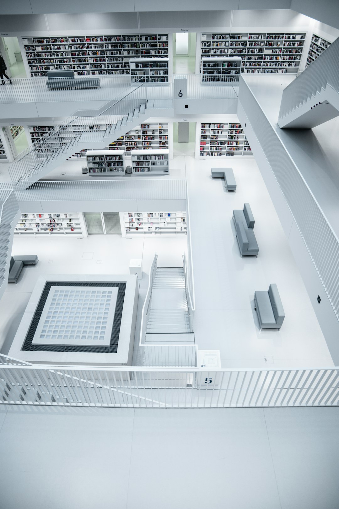 white stairs and book shelves