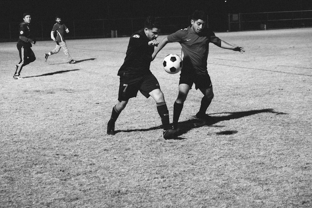 men playing soccer