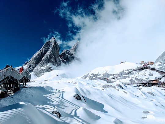 white and gray mountain in Jade Dragon Snow Mountain China