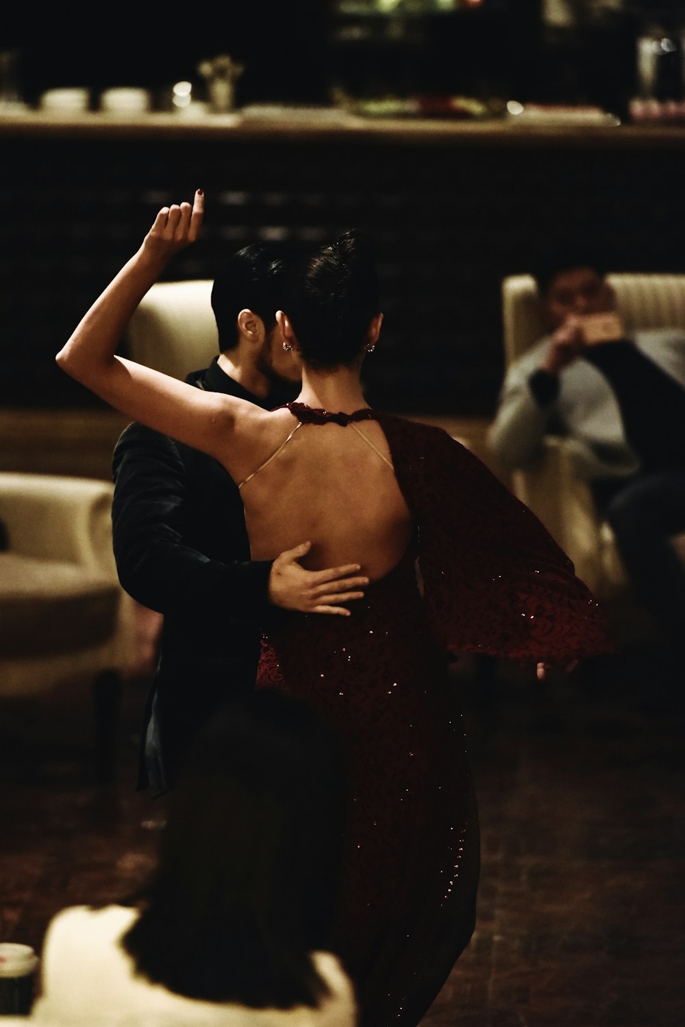 man and woman dancing indoors