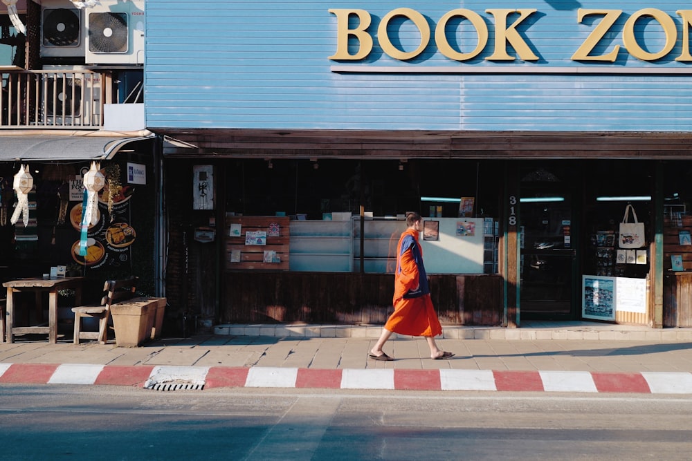 man passing store