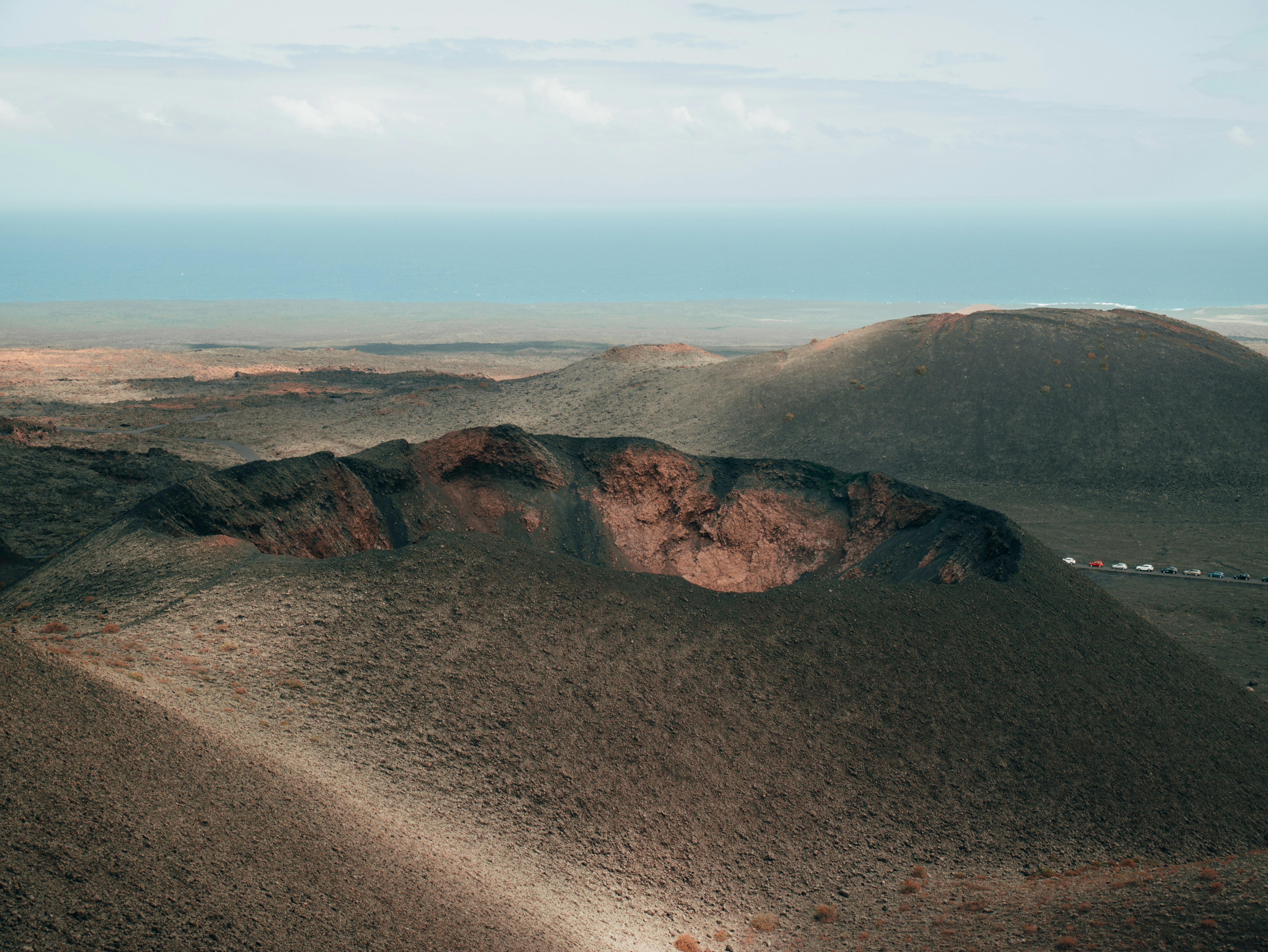 view photography of mountain during daytme, This photo was taken on a trip to Lanzarote, Spain, a land carved over the Atlantic on fire and lava.