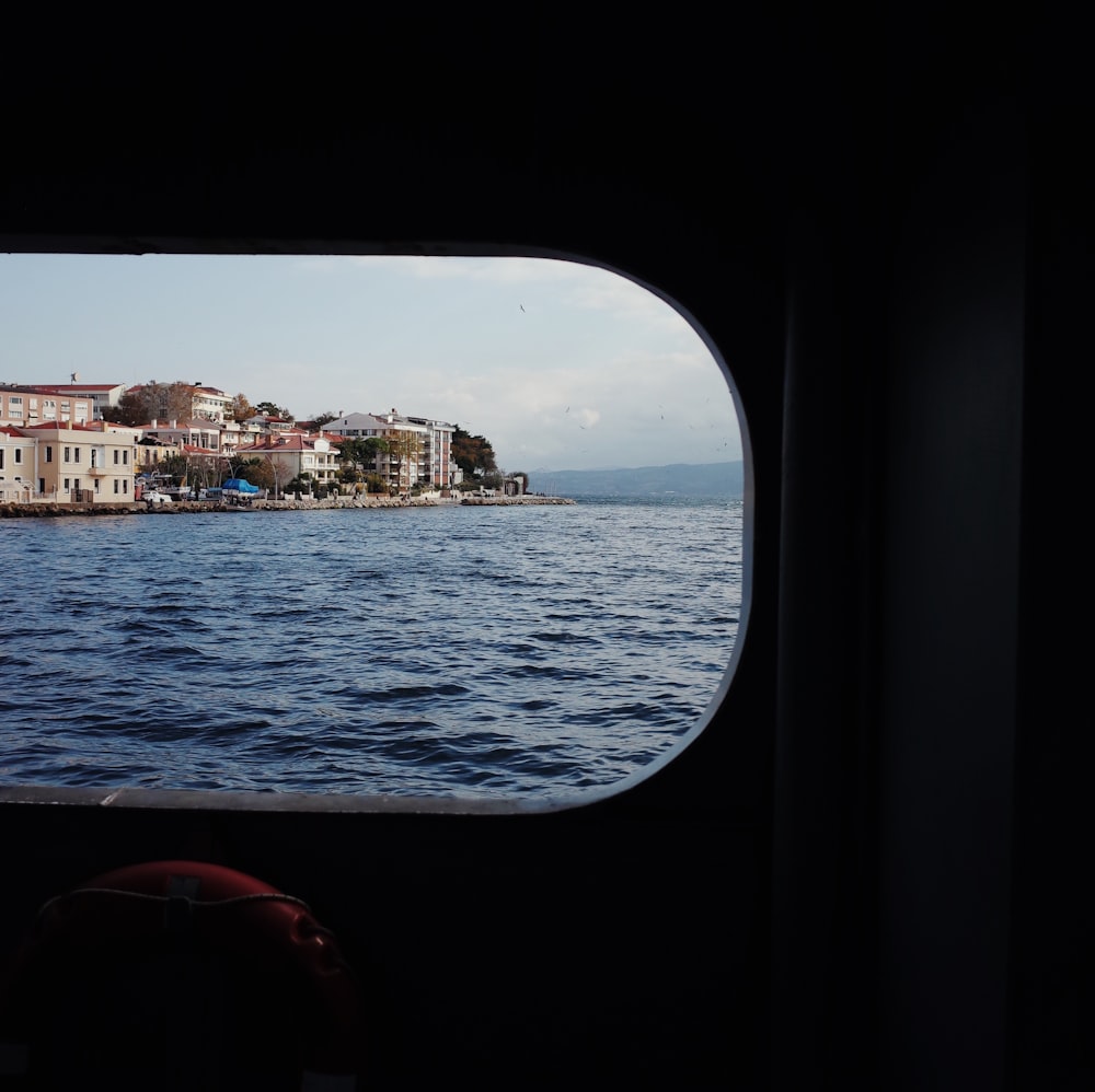 view photography of sea and city building