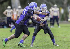 time-lapse photography of men playing football in field