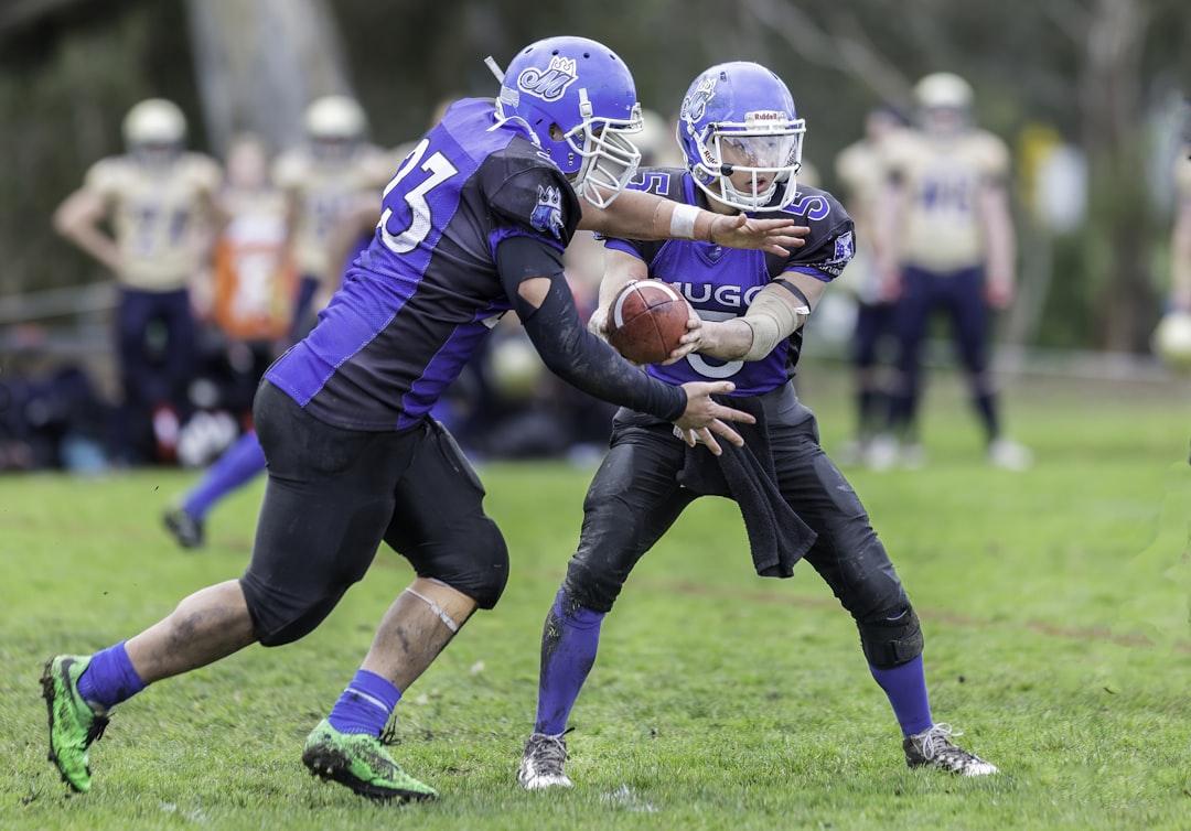 time-lapse photography of men playing football in field, Gridiron Victoria - Melbourne Uni Royals
