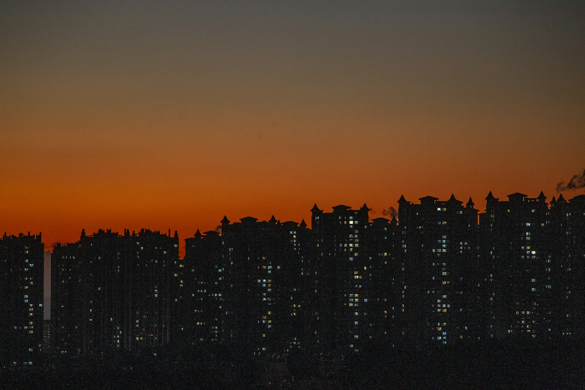 woman wearing yellow long-sleeved dress under white clouds and blue sky during daytime