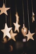 shallow focus photo of wooden stars hanging decor