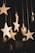 shallow focus photo of wooden stars hanging decor