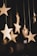 shallow focus photo of wooden stars hanging decor