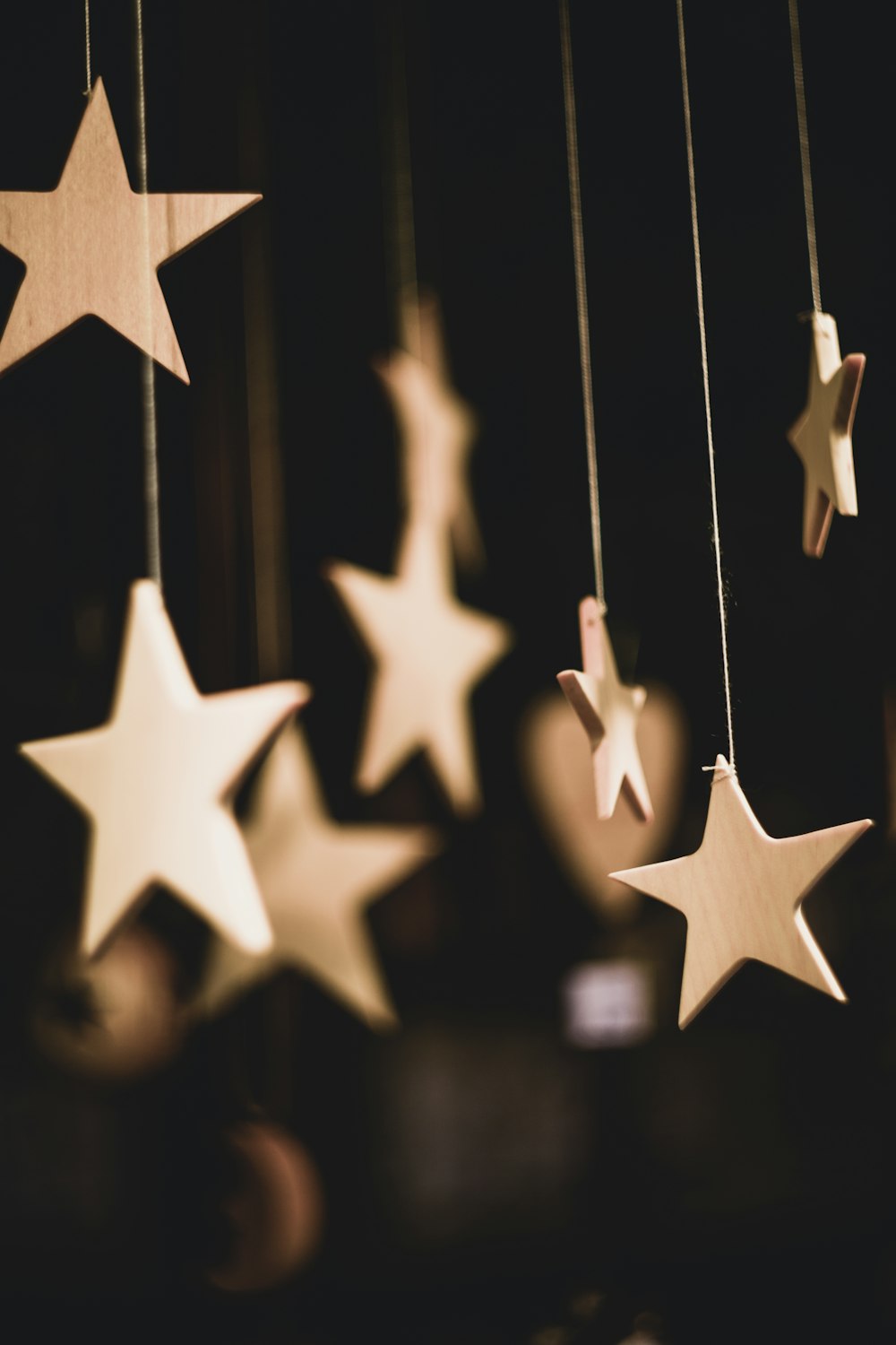 shallow focus photo of wooden stars hanging decor