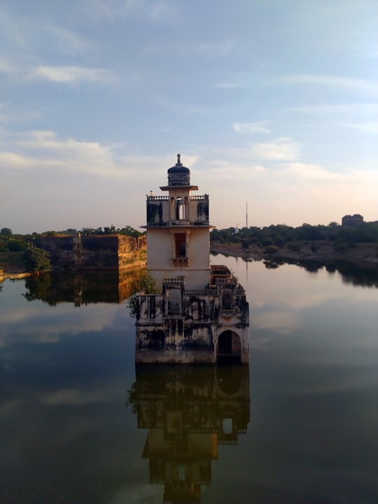 white castle in the middle of the sea in Chittorgarh Fort India
