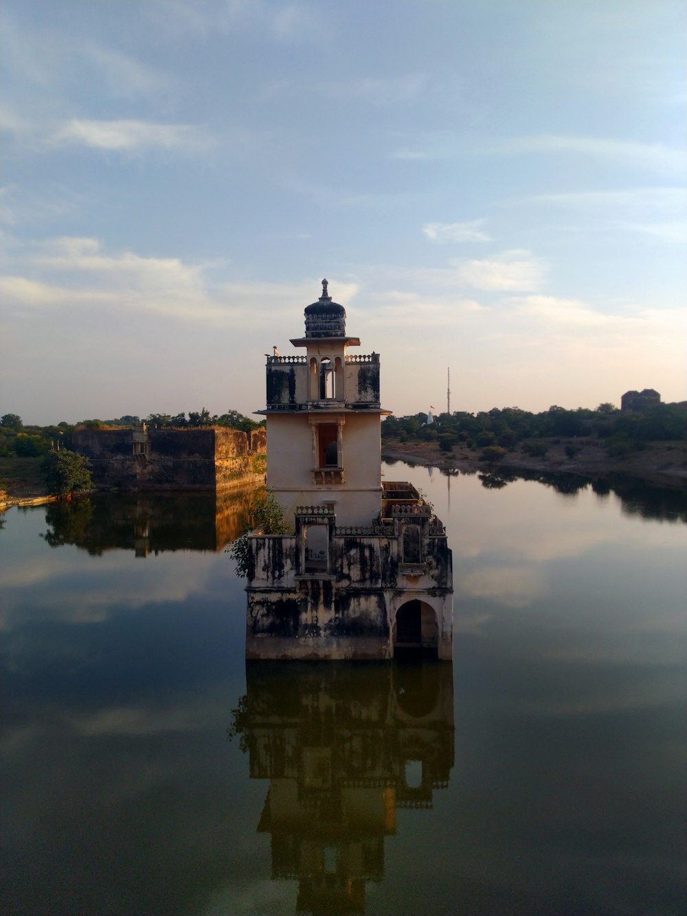 white castle in the middle of the sea