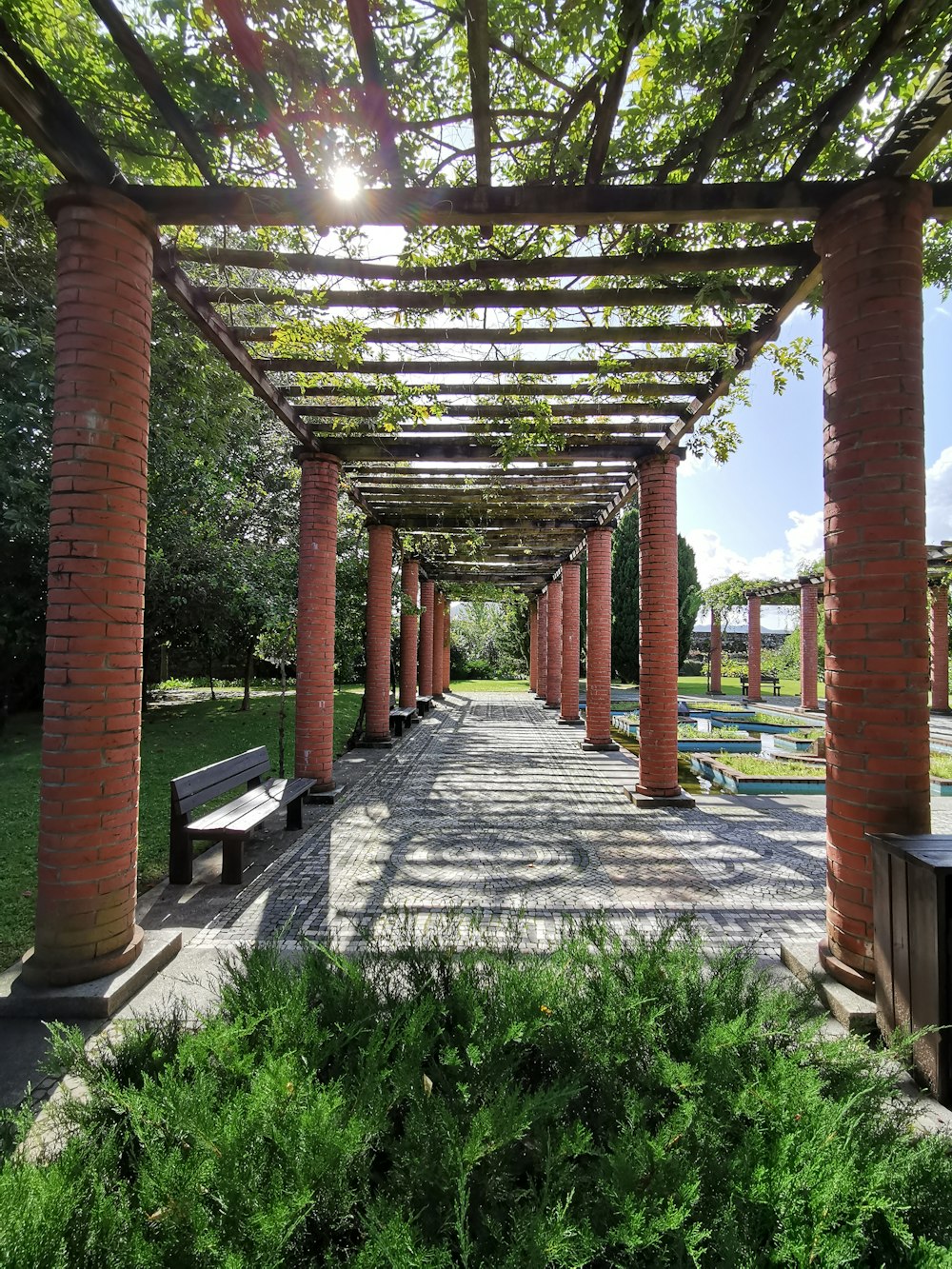 brown pillar garden arch