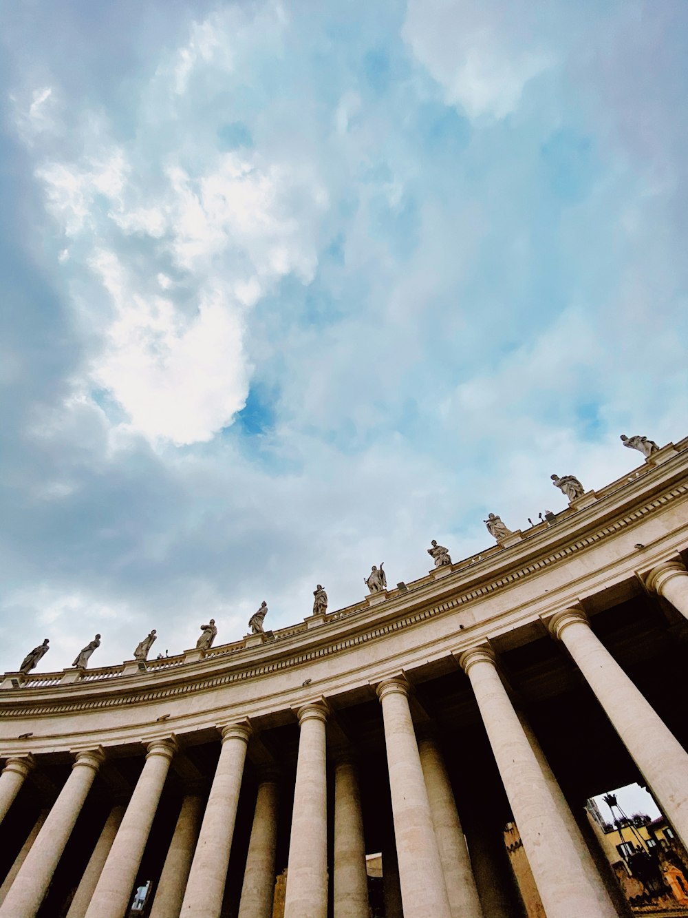 Corinthians columns under white clouds