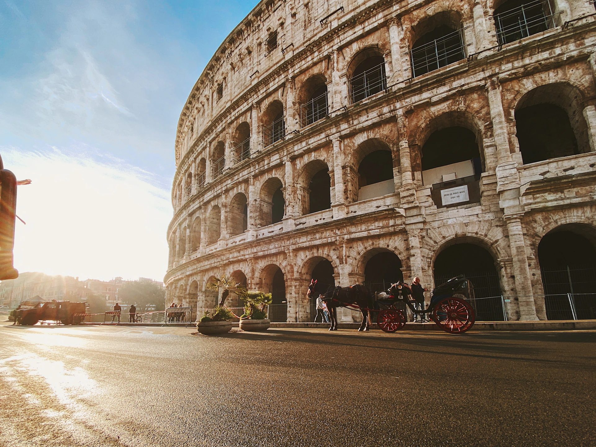 horse and carriage beside The Colosseum