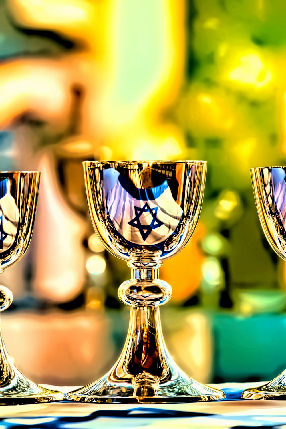 three gold goblets on flag of Israel