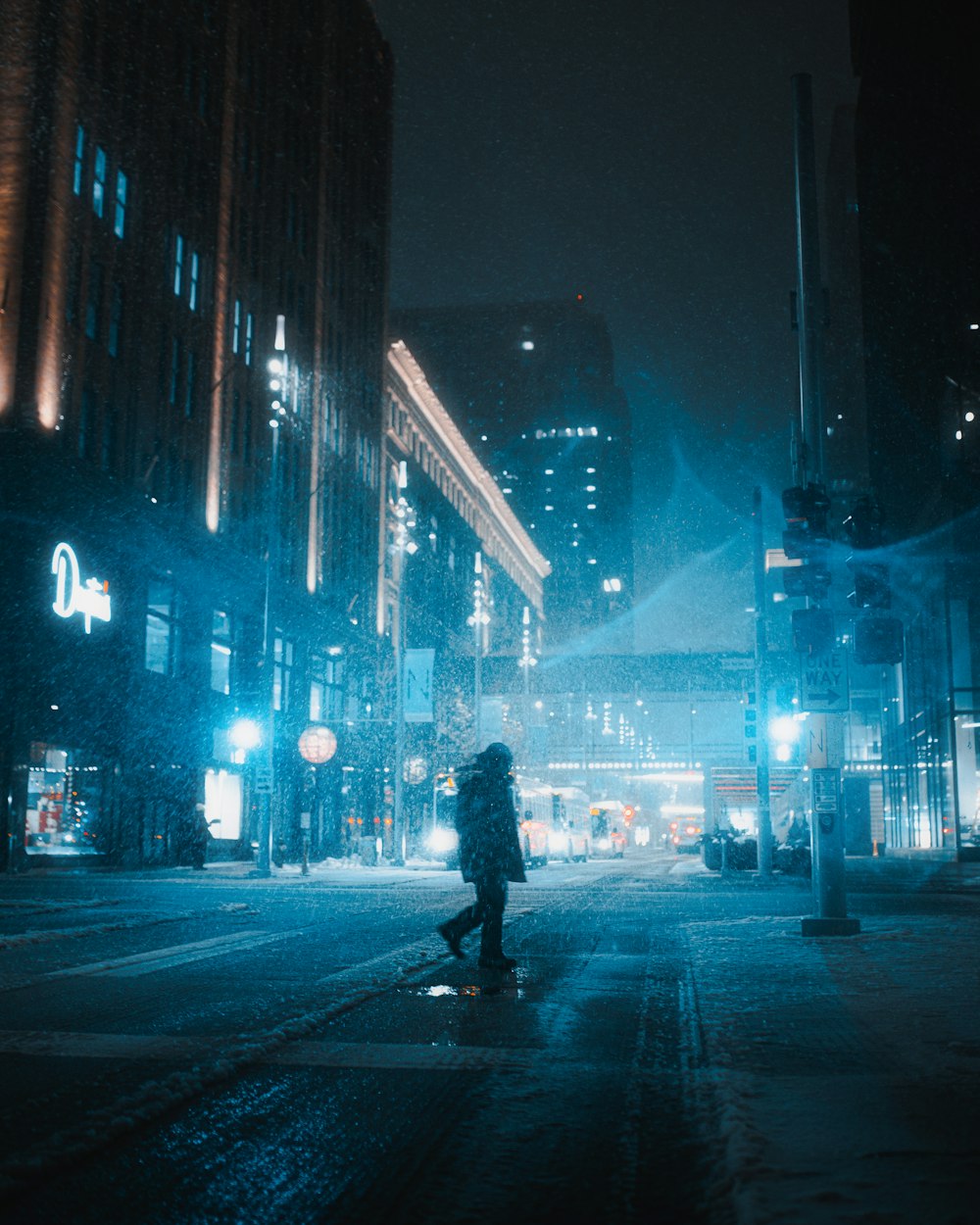 silhouette of man walking on pedestrian lane