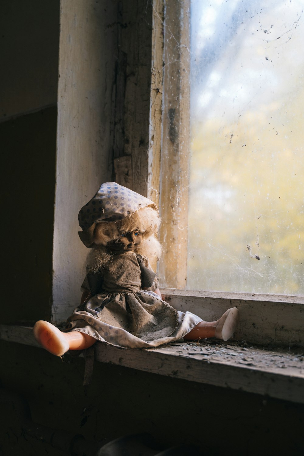 porcelain doll wearing gray and white dress