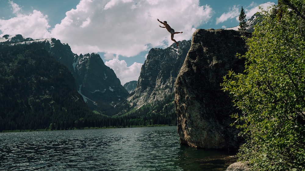 person jumping on edge