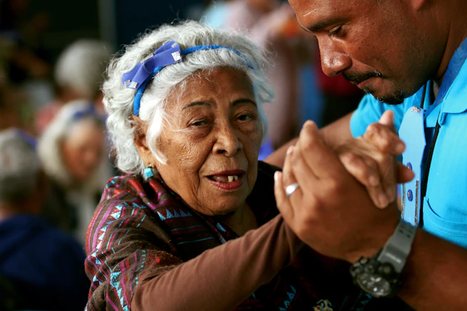 woman dancing with health care worker