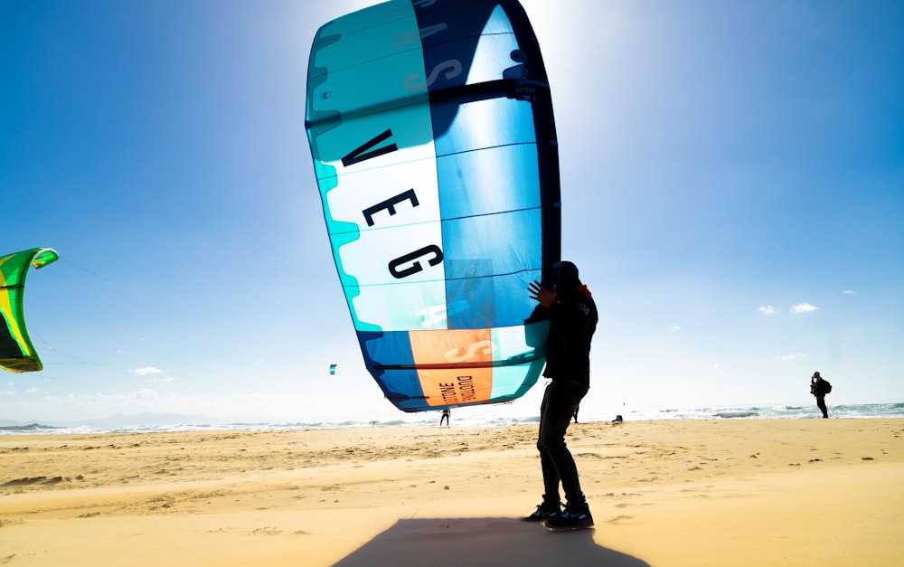 a man standing on top of a sandy beach