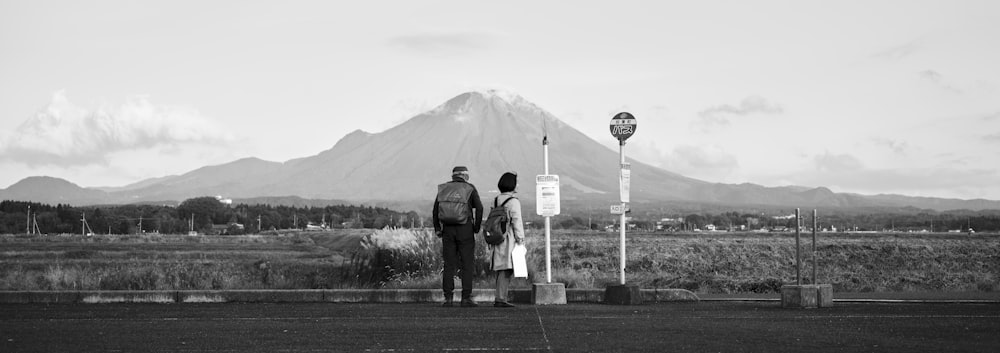 a couple of people standing next to each other