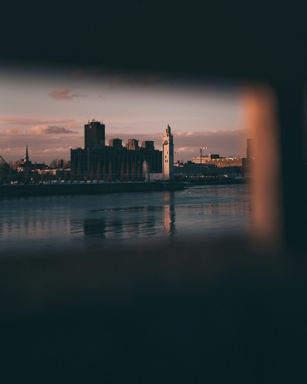 a large body of water with a city in the background