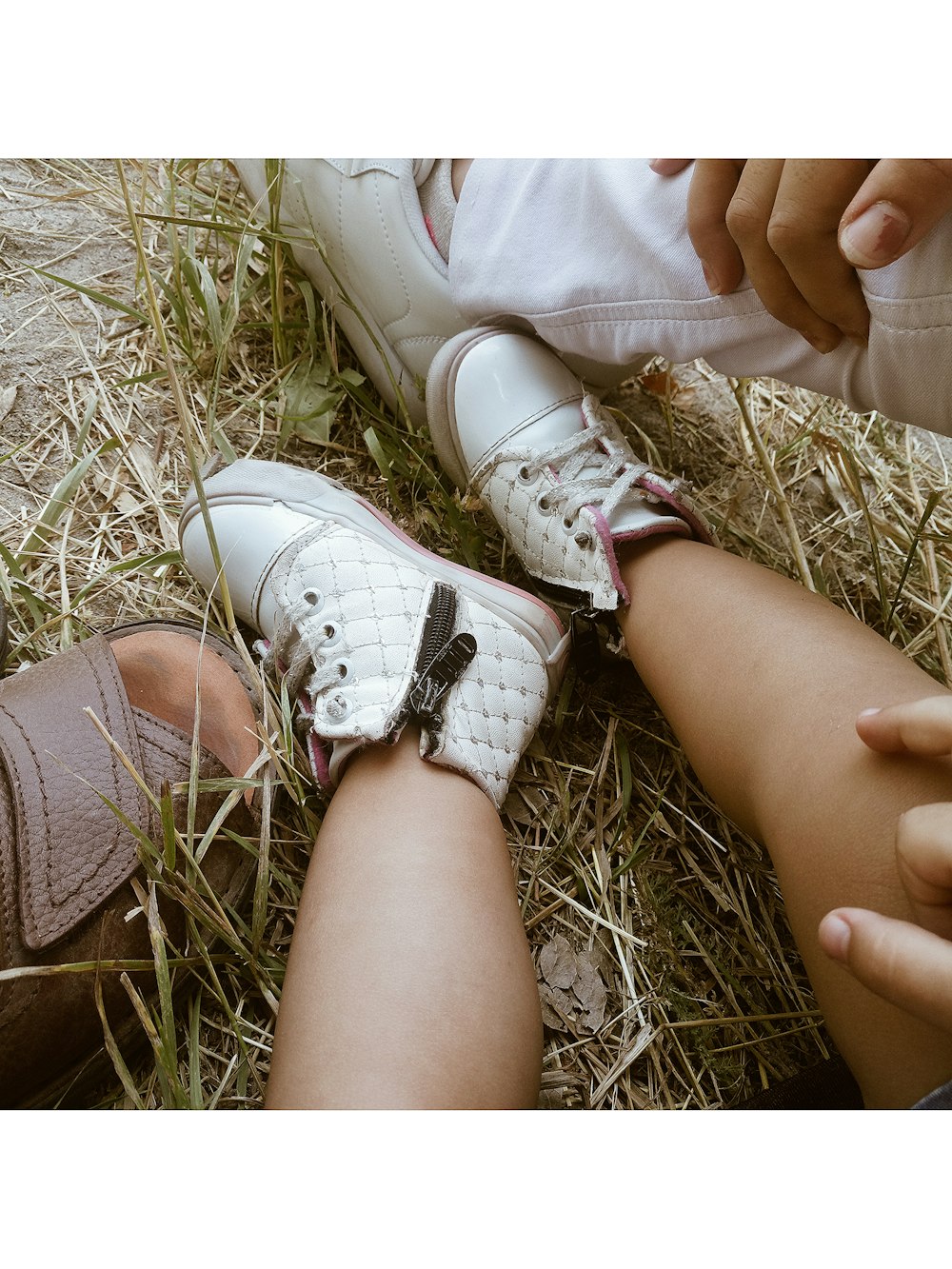 man and baby wearing shoes