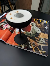 An elegant custom cocktail glass with subtle branded advertisements on the side.