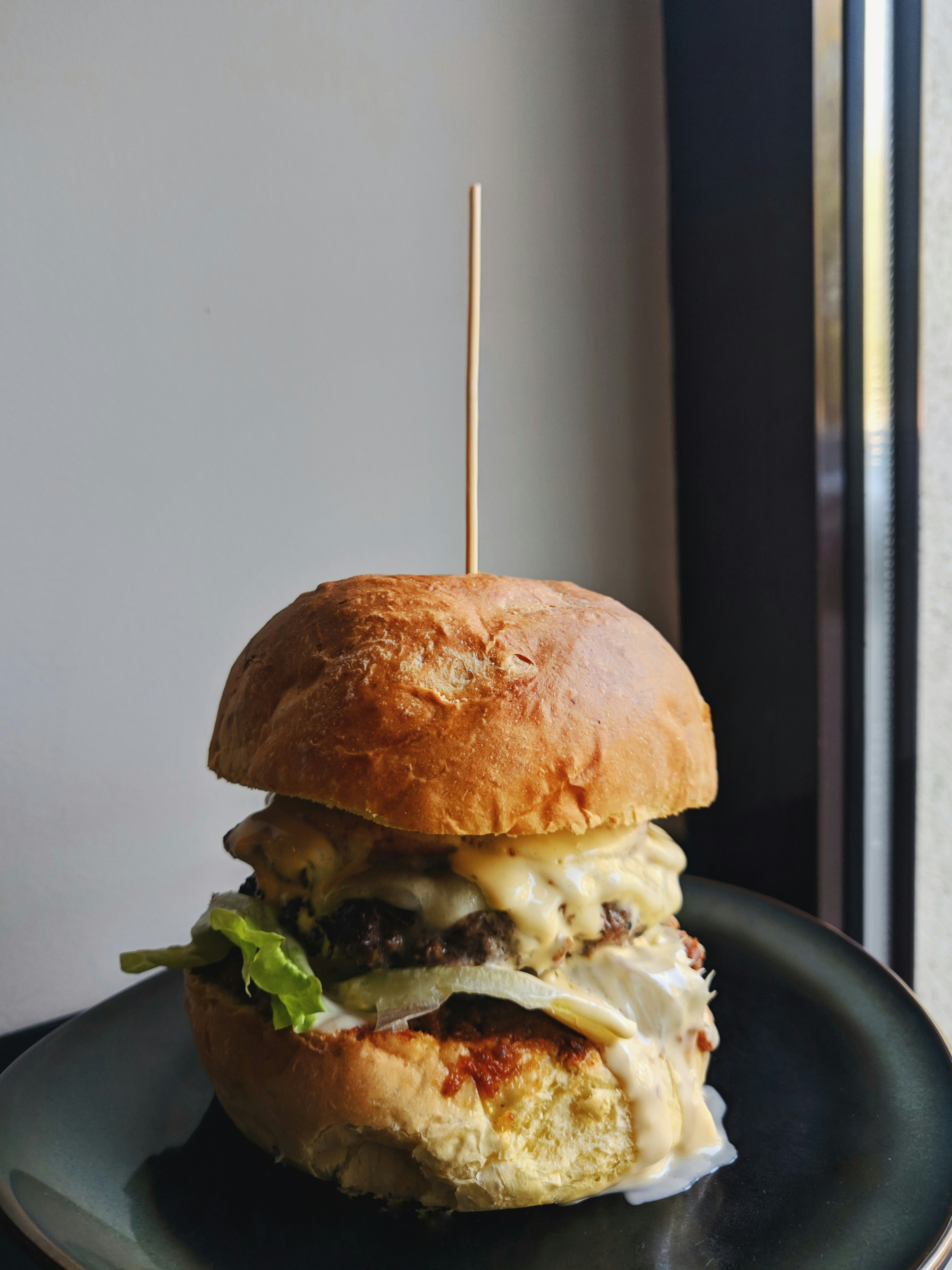 burger dish on gray ceramic plate