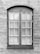 A symmetrical, rectangular window framed with dark wood is set into a textured stone wall. The window consists of two panels, each containing multiple small glass panes separated by white muntins. The surface of the wall appears uneven with visible brush strokes or trowel marks.
