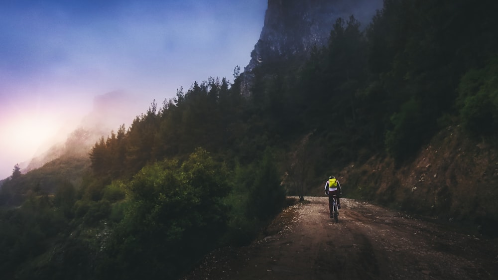 photography of man riding bicycle during daytime