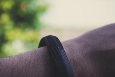 Close-up of a wristband biosensor capturing daytime physiological signals in a research lab setting.