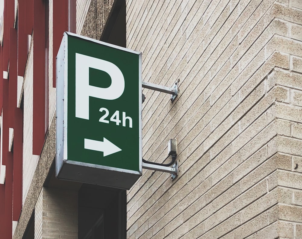 white and green P24h signage