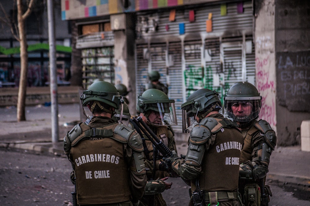 group of Chilean police standing beside concrete structures