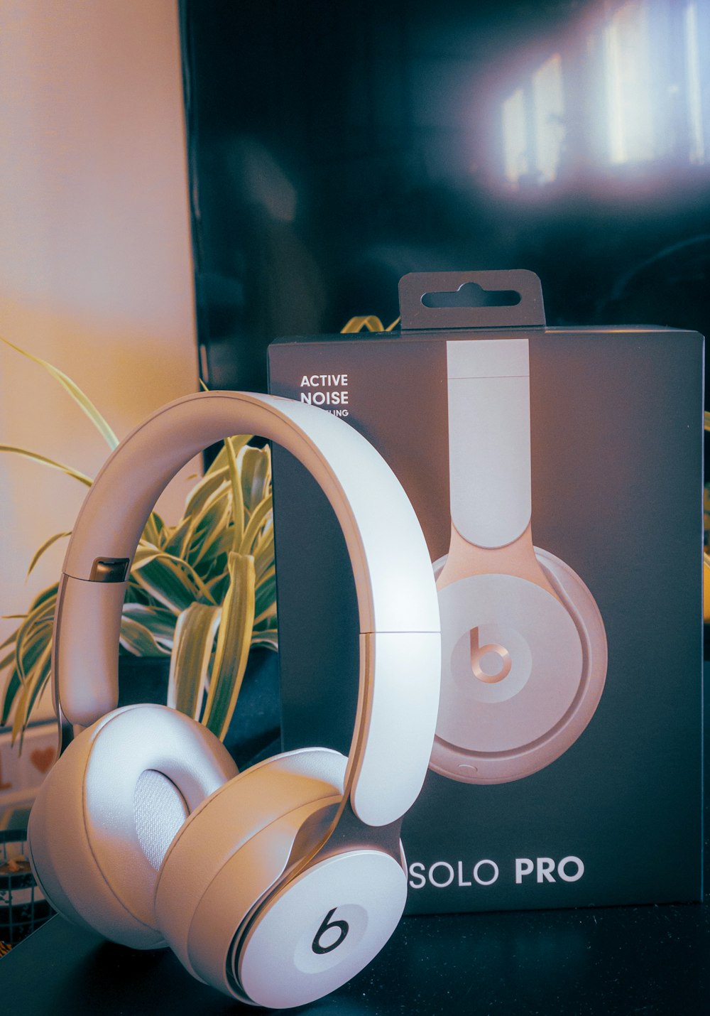 white and orange Beats Solo Pro by Dr. Dre with box