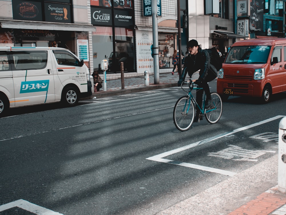 person riding bike on road